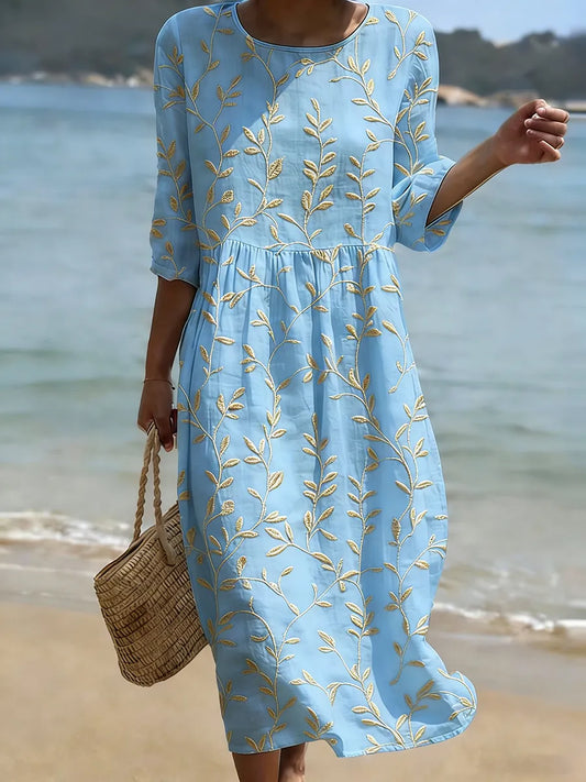 Vestido midi con estampado floral y cuello redondo