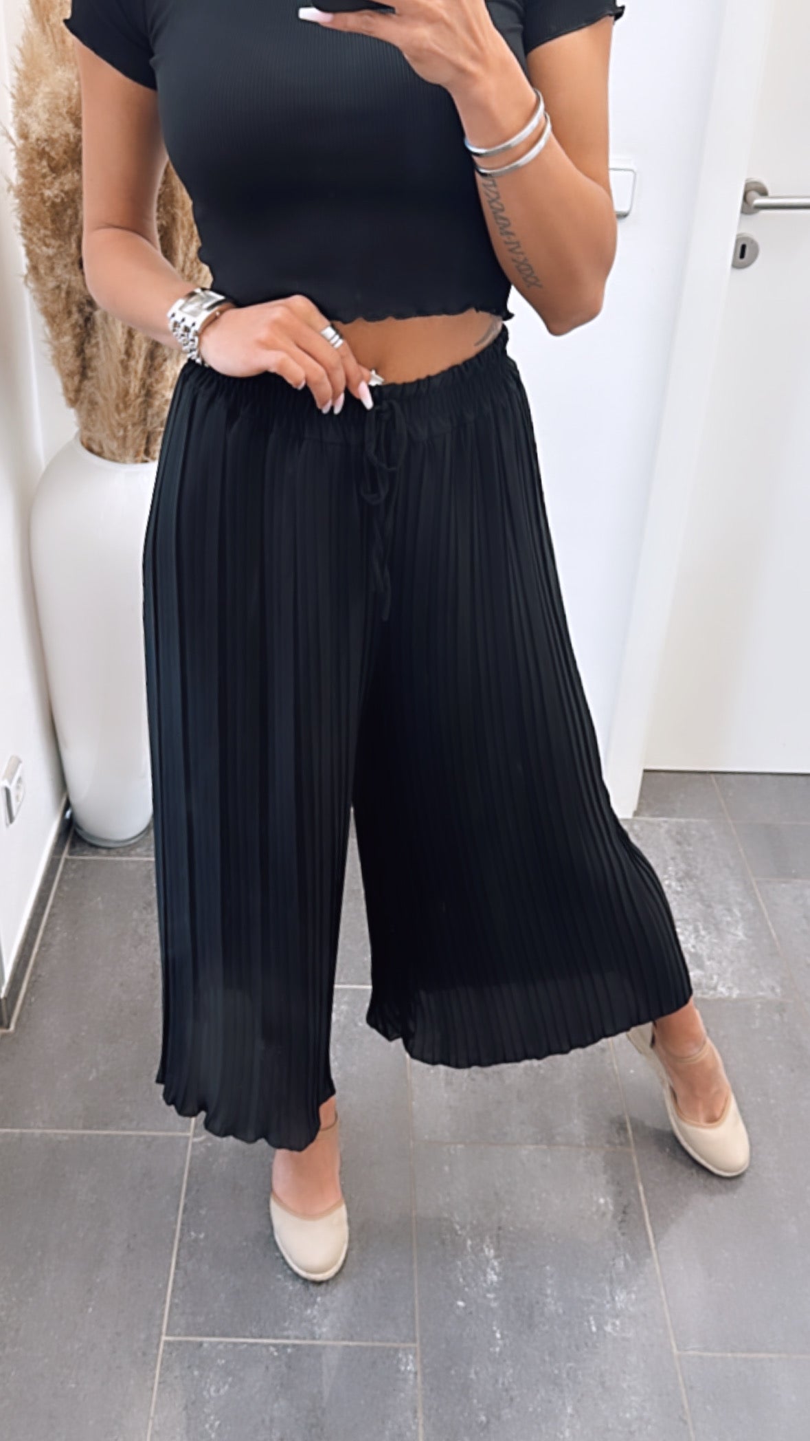 Pantalones plisados negros